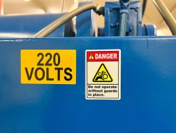 Do not operate without guards danger sign on blue machine parts