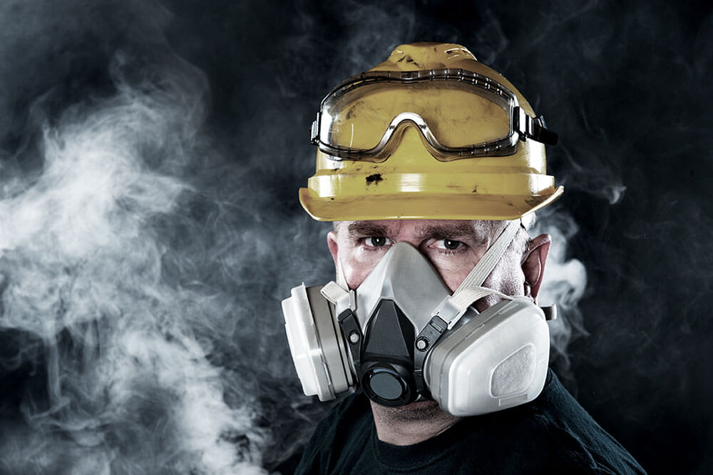 Worker wearing respiratory protection