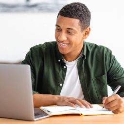 Student taking online course from laptop